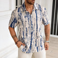 Man wearing a striped short sleeve casual shirt in a light colour, showcasing the 3D print detail.