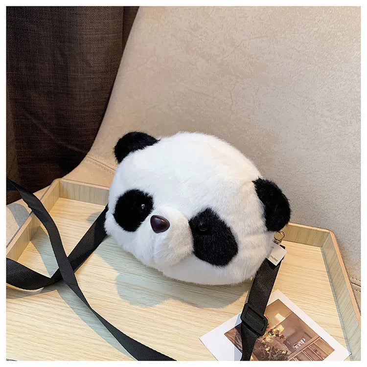 Soft plush crossbody bag with panda head design, cylindrical shape.