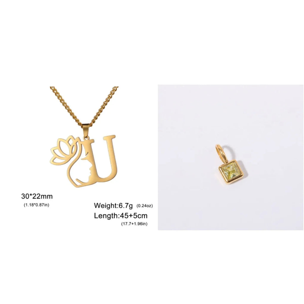 Gold electroplated stainless steel necklace with a cross chain and a letter 'A' pendant on a white background.