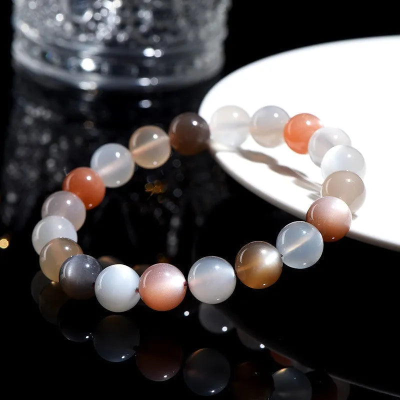 Unisex moonstone bracelet with colourful moonlight 8mm beads on a white background.