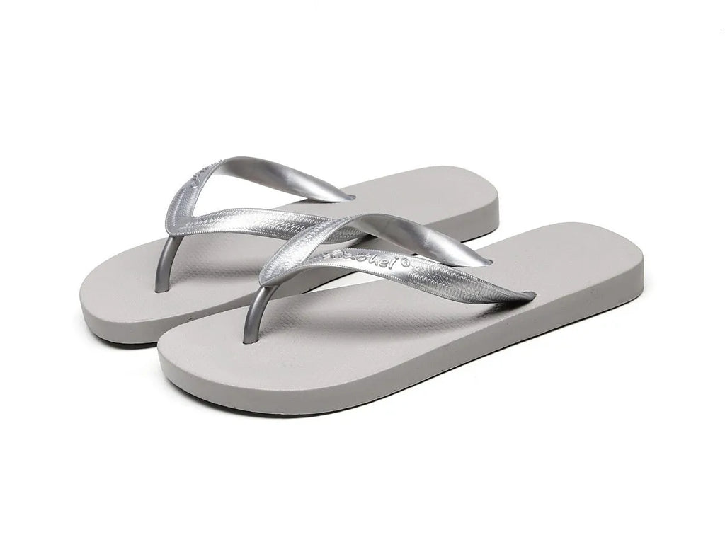 Women's flat bottom solid colour breathable PVC slippers in black, blue, and gray