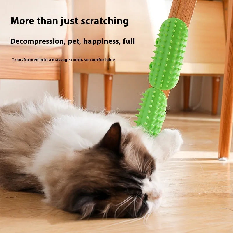 Silicone cat grooming comb with rounded teeth and adjustable strap mounted on a table leg.