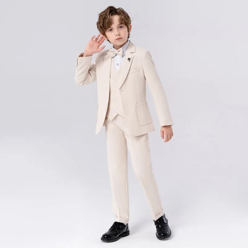Boy's solid colour British style suit dress set with coat, trousers, vest, bow tie, and brooch on a hanger