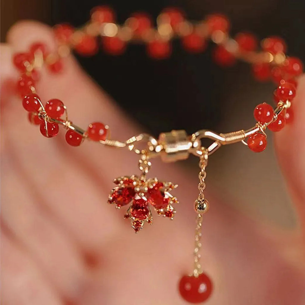 Red ginkgo leaf charm on an alloy magnetic bracelet with Chinese style design.