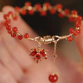 Red ginkgo leaf charm on an alloy magnetic bracelet with Chinese style design.