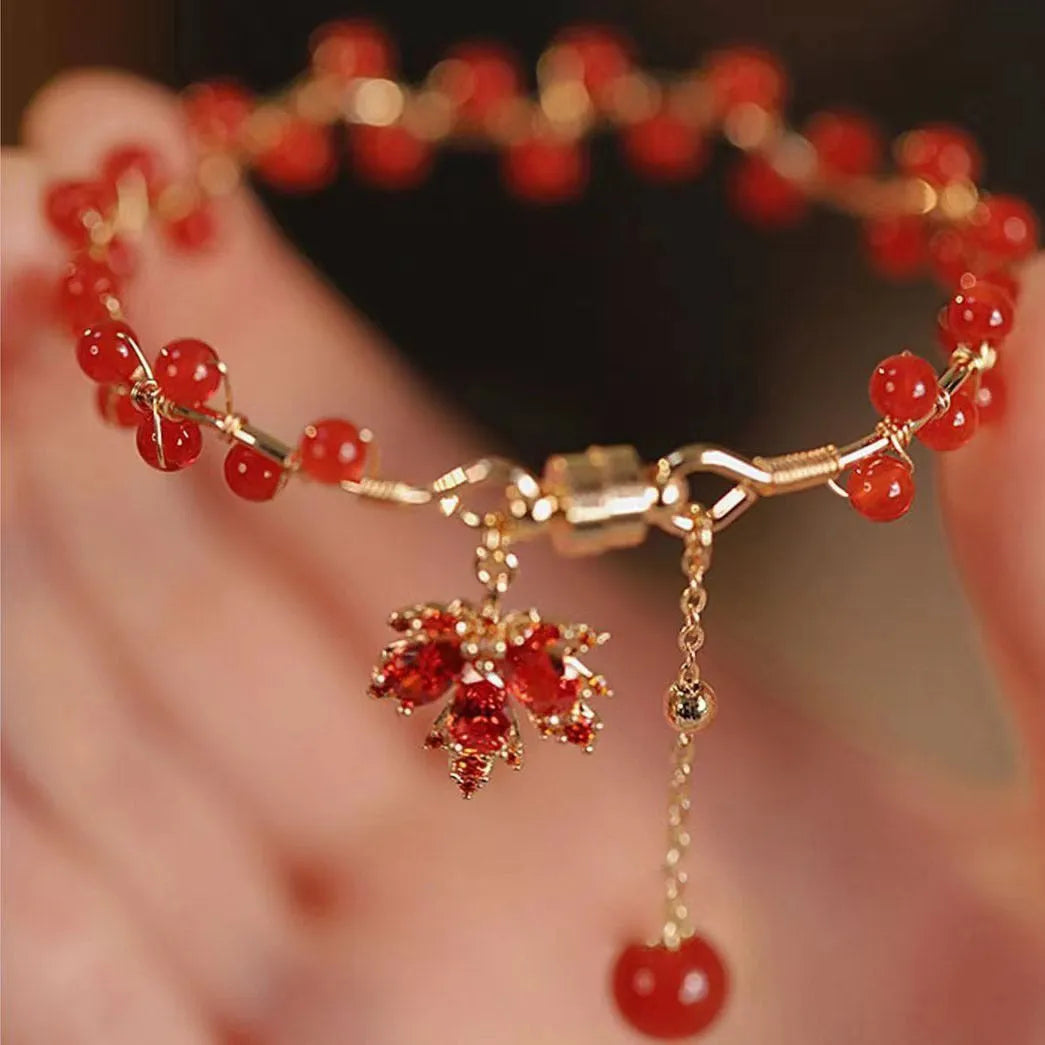 Red ginkgo leaf charm on an alloy magnetic bracelet with Chinese style design.