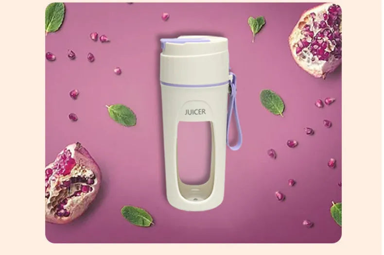 Portable USB electric blender with borosilicate glass cup in fresh orange, grass green, and light purple colours.