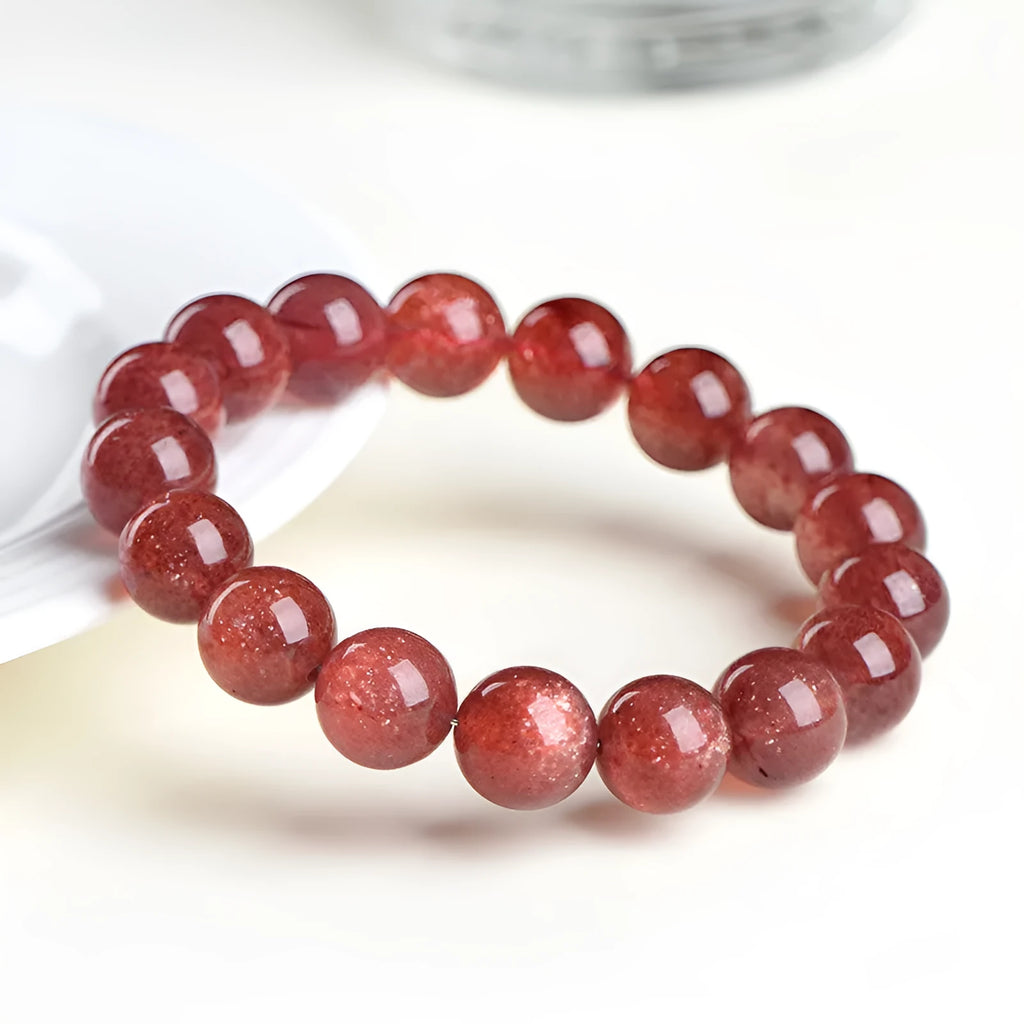 Natural strawberry quartz bracelet in starlight cherry red colour with geometrically shaped crystal beads