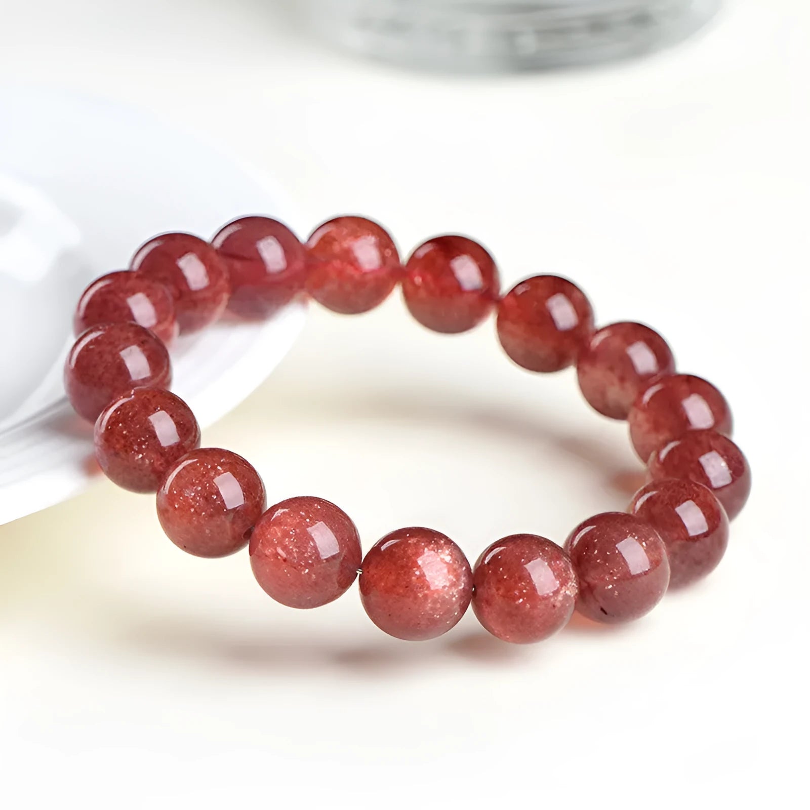 Natural strawberry quartz bracelet in starlight cherry red colour with geometrically shaped crystal beads
