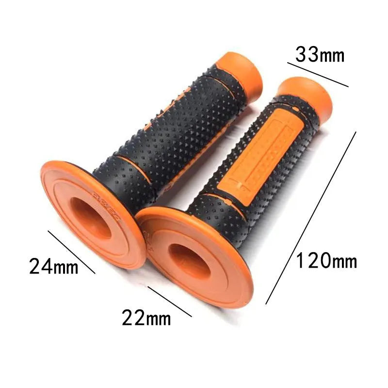 Pair of black and orange rubber motorcycle handle covers for KTM off-road bikes, shown on handlebars