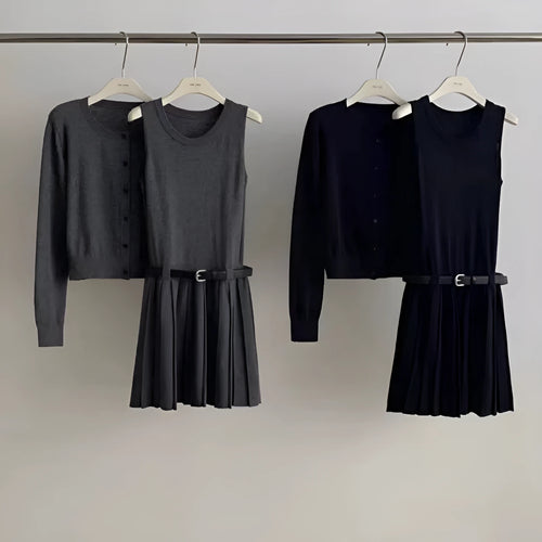 Women's grey knitted vest skirt and long-sleeve cardigan set with 3D pattern and an adjustable waist belt.