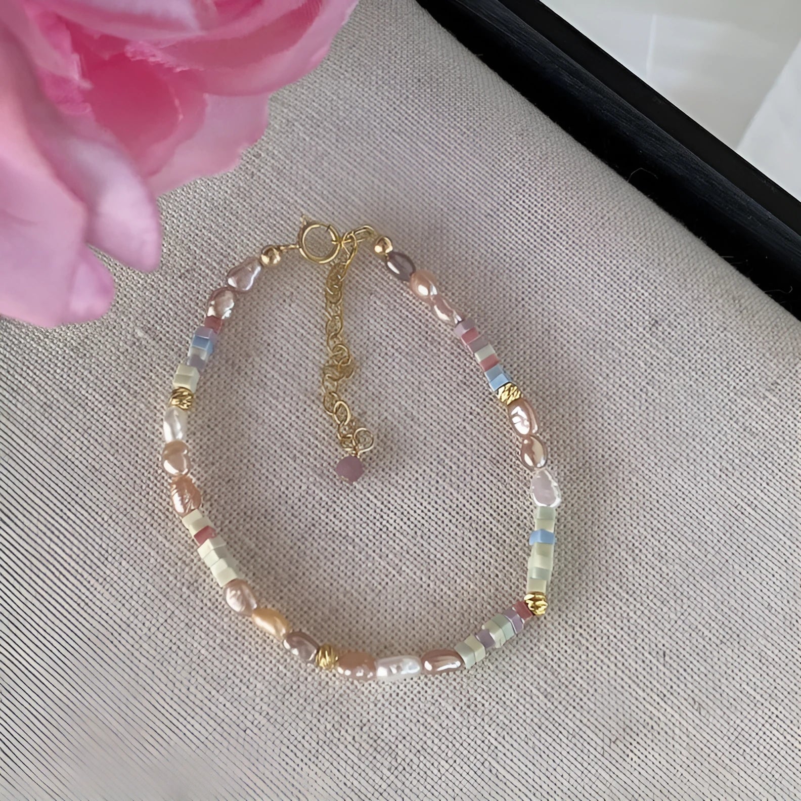 Women's natural pearl bracelet and necklace set with a purple and gold-plated clasp on a silver chain.
