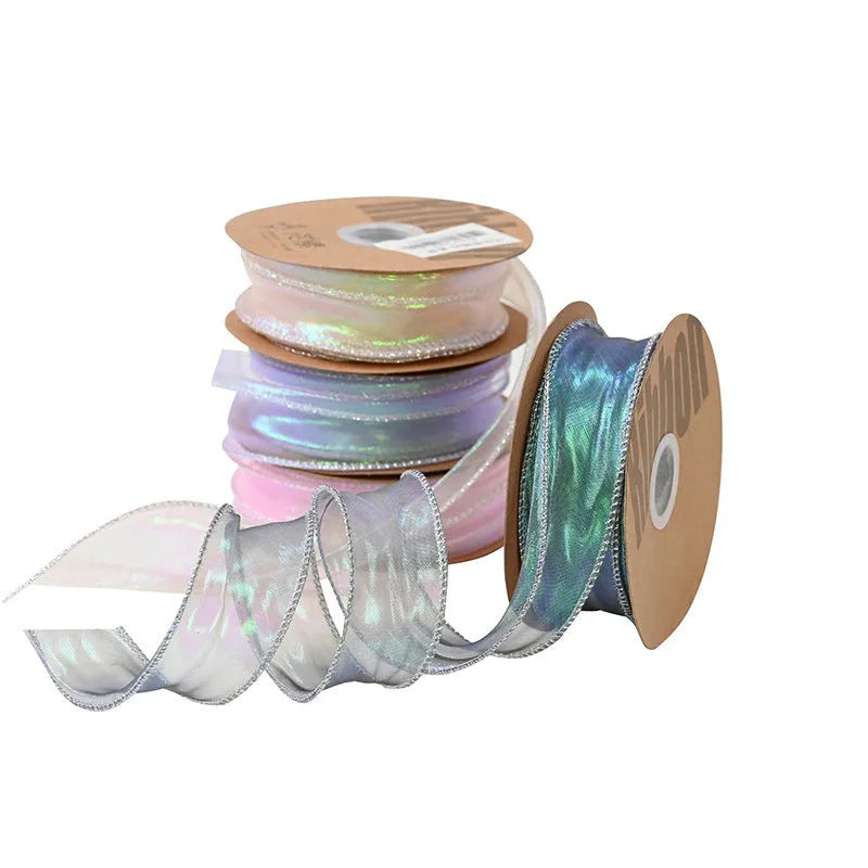 Roll of 4cm wide fishtail fringe mesh ribbon in Illusion Champagne colour.