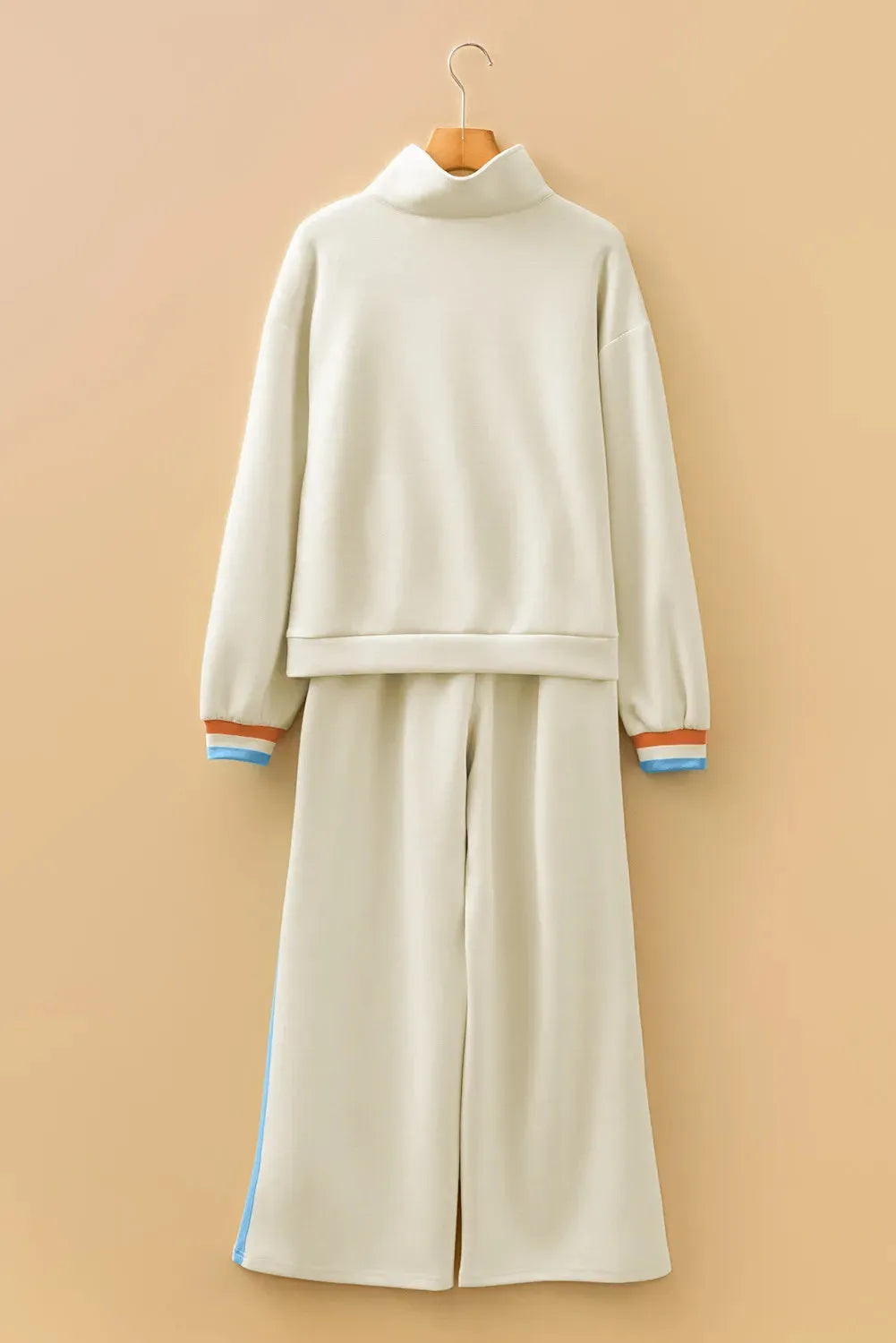 Apricot striped patchwork quarter zip pullover and loose pant set on model, women's two-piece loungewear
