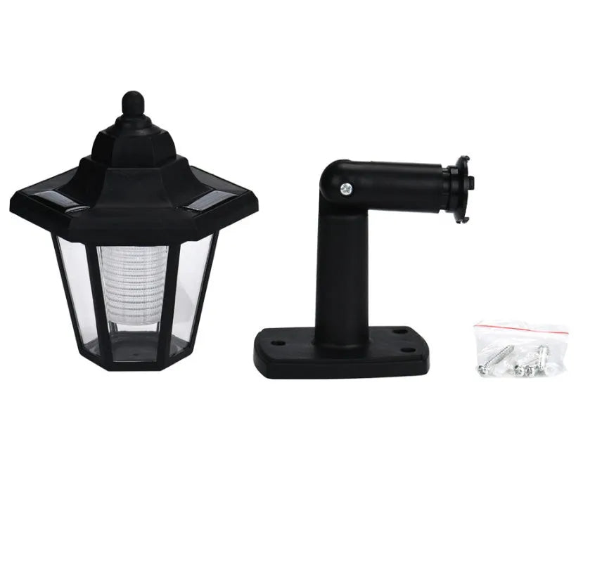 Black hexagonal solar wall lamp with automatic light sensor for outdoor installation
