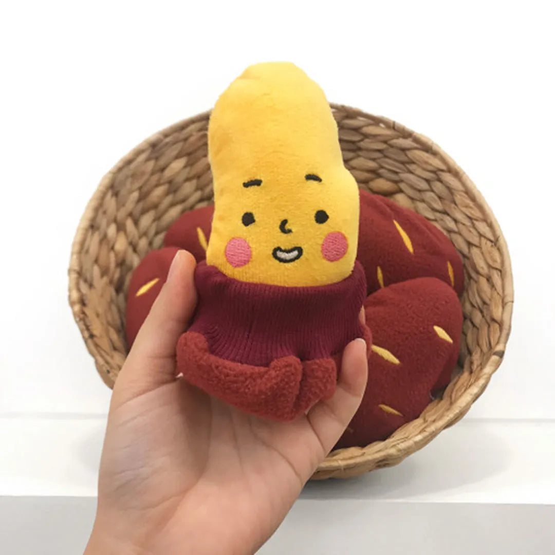 Red sweet potato pet toy with peelable exterior revealing hidden food pocket for treat dispensing