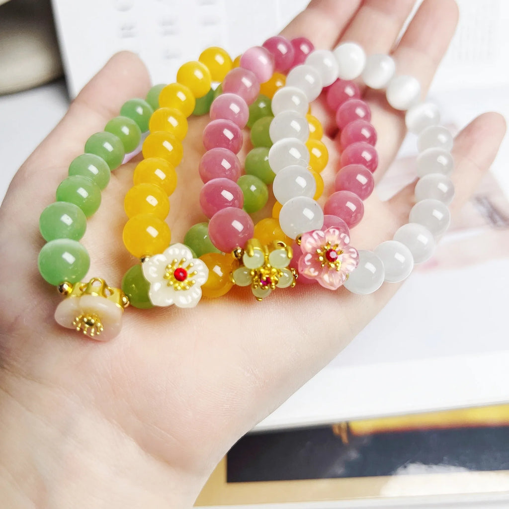 Handmade glass beaded bracelet with floral design in yellow, pink, white or green colour options