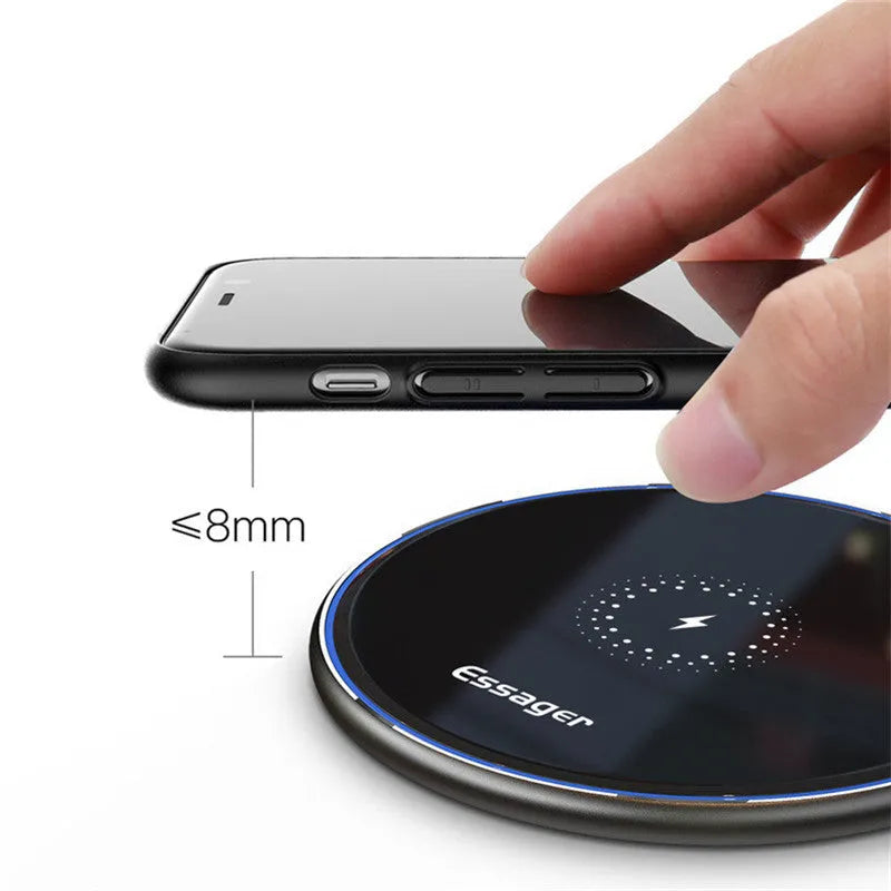 Black aluminium alloy 15W Qi wireless charging pad on a table with LED light.