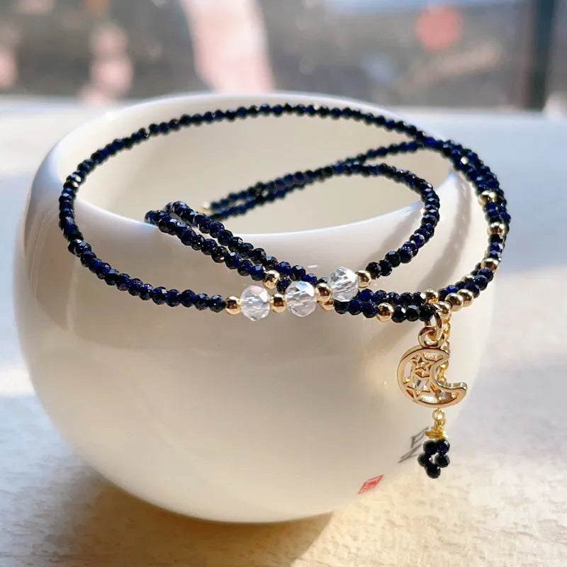 Women's blue sand stone bracelet with three gold-coloured rings in multi-layer design