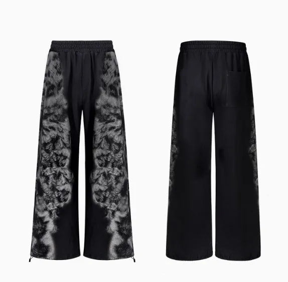 Streetwear co-ord set showing hoodie, full-length trousers, and seven-inch shorts with printed design and collage stitching detail.