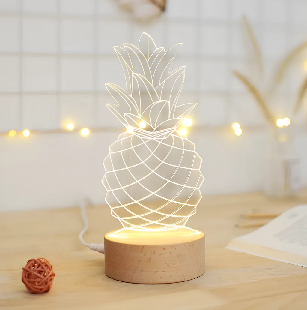 Wood and acrylic cartoon pineapple USB bedside lamp with dimming switch on a table.