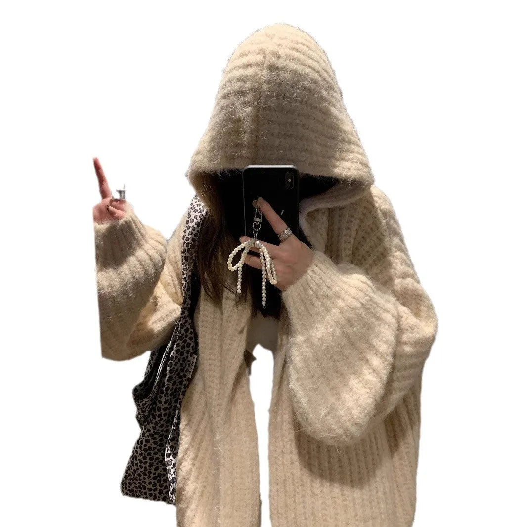 A woman's loose-fitting, hooded sweater cardigan in a solid colour, shown with regular sleeves.