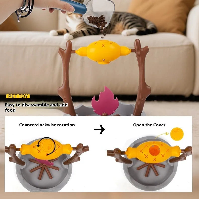 Barbecue-themed tumbling cat food feeder toy with treat dispenser, shown next to dry kibble.
