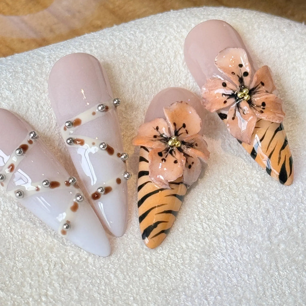 Handmade French style nail stickers with leopard print, cross, and floral patterns in four sizes