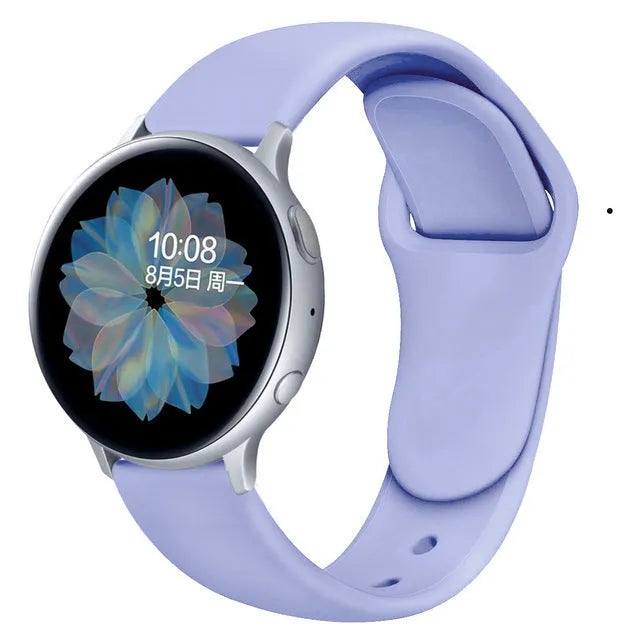 Samsung Galaxy Active 2 watch with a purple reverse buckle silicone strap on a wrist.
