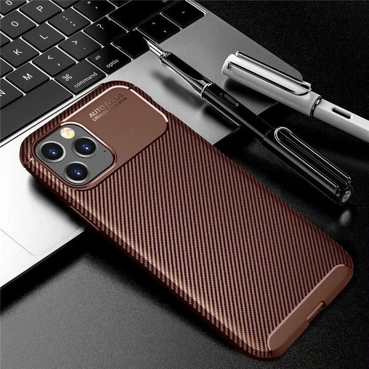 Black silicone protective case for an iPhone 12 smartphone on a table.