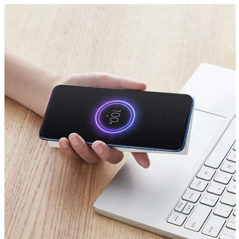 Black and white 10000mAh power bank with USB-C port and wireless charging symbol