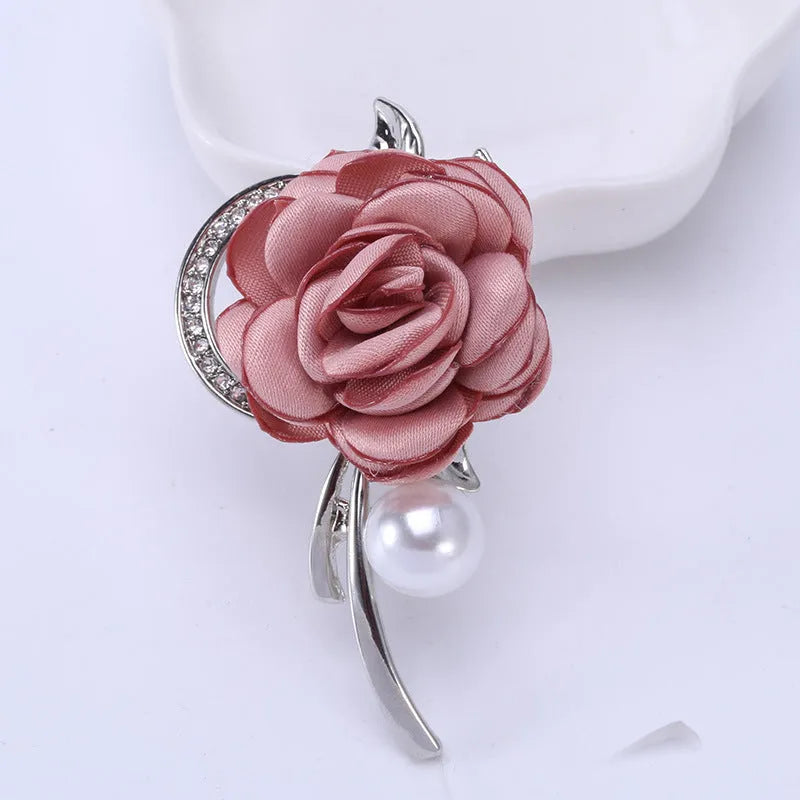 Rose brooch in Korean style, alloy construction, blue colour, 4.5cm by 3.8cm, on white background