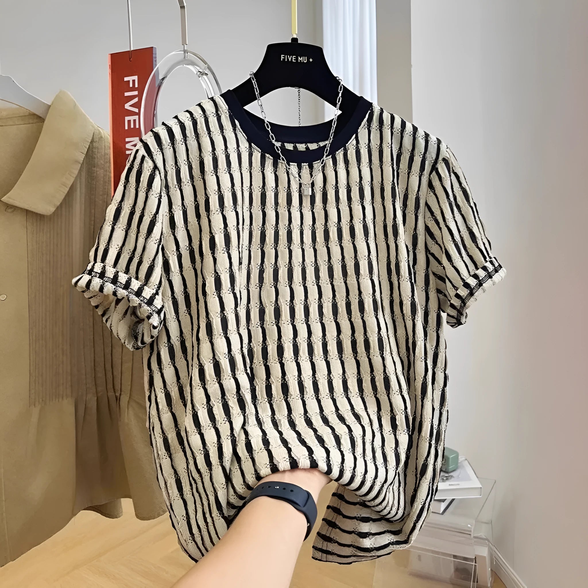 Black and white striped men's casual linen blend shirt with short sleeves and a loose fit.