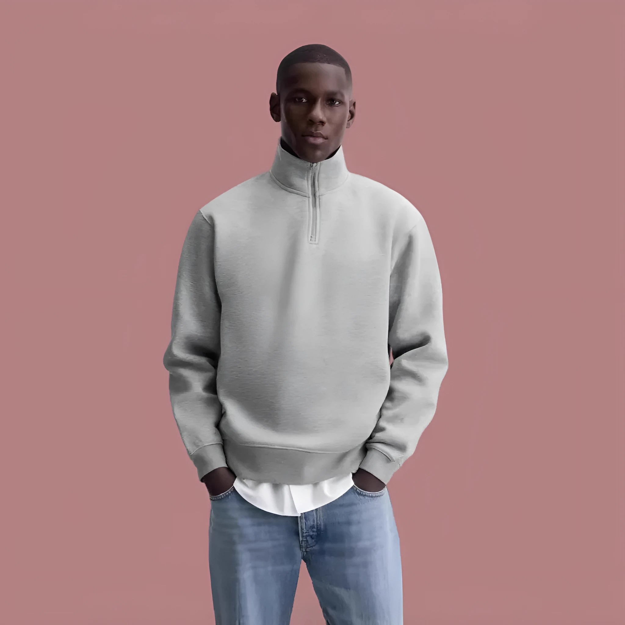 Grey half-zip cotton hoodie with a stand collar, shown on a model.
