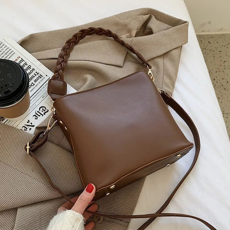 Retro one-shoulder crossbody bucket bag in woven PU material, shown in khaki colour.