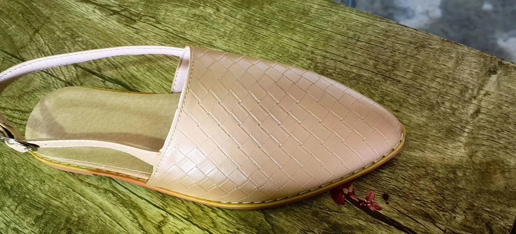 A pair of pointed-toe baotou flat sandals with an adjustable buckle strap, shown in a dark brown colour.
