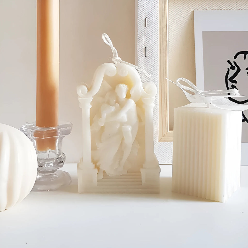 Square elf shaped silicone baking mold for angel aromatherapy candle ornaments and cake decorating on a plain background