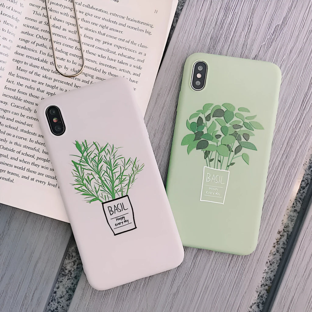 White silicone iPhone case with a detailed painted plant pattern on the back, showing its 360-degree protective edges.
