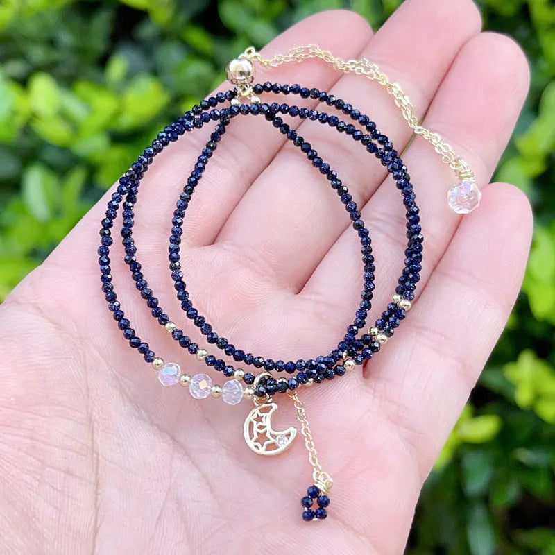 Women's blue sand stone bracelet with three gold-coloured rings in multi-layer design