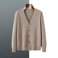 Man wearing a beige Andy velvet V-neck cardigan coat with long sleeves.