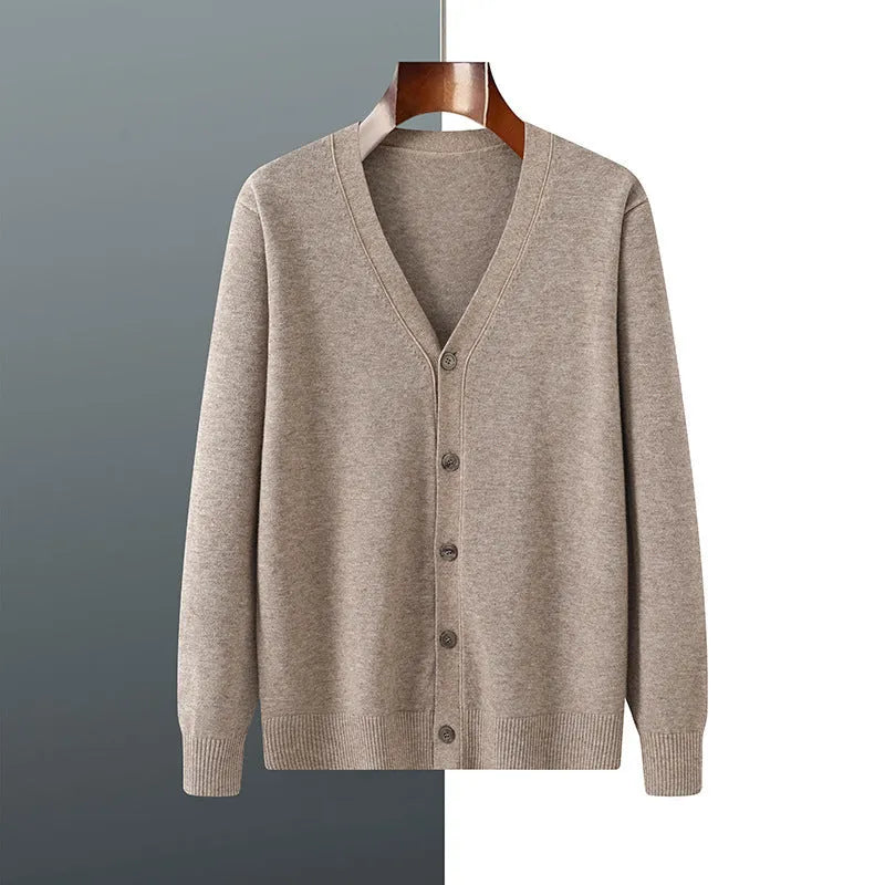 Man wearing a beige Andy velvet V-neck cardigan coat with long sleeves.
