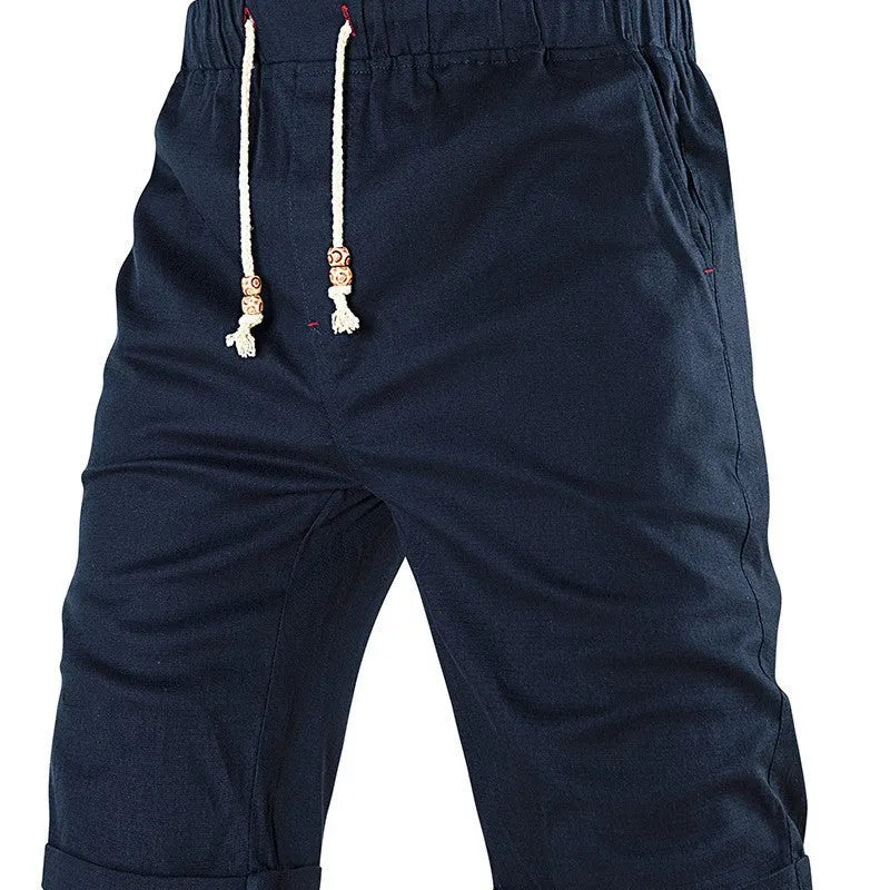 Men's cotton-blend casual shorts in khaki with a drawstring waist and zipper pocket.