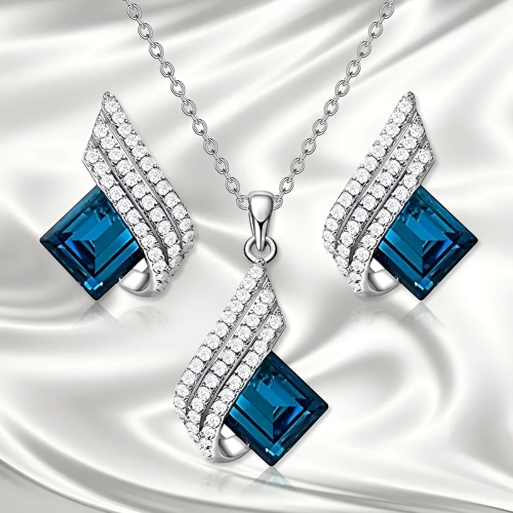 Silver-tone cross chain necklace and matching earring set with glass pendant details