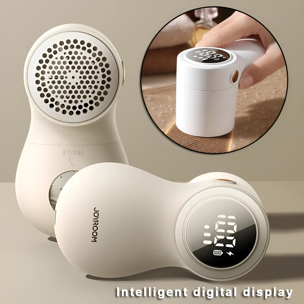White electric lint remover with LED display and USB charging port on a fabric surface.