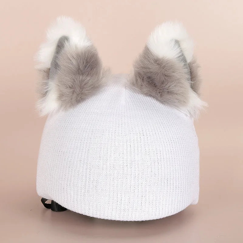 A soft plush cartoon character cover stretched over a medium-sized motorcycle helmet.