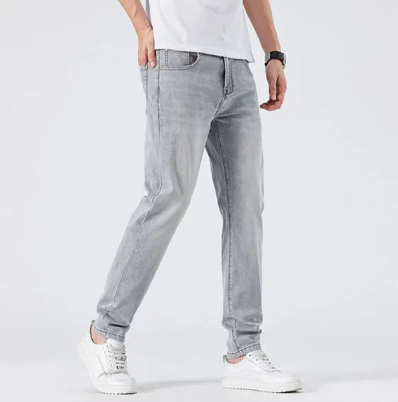 Men's light wash slim straight leg jeans in light grey cotton with no-iron finish