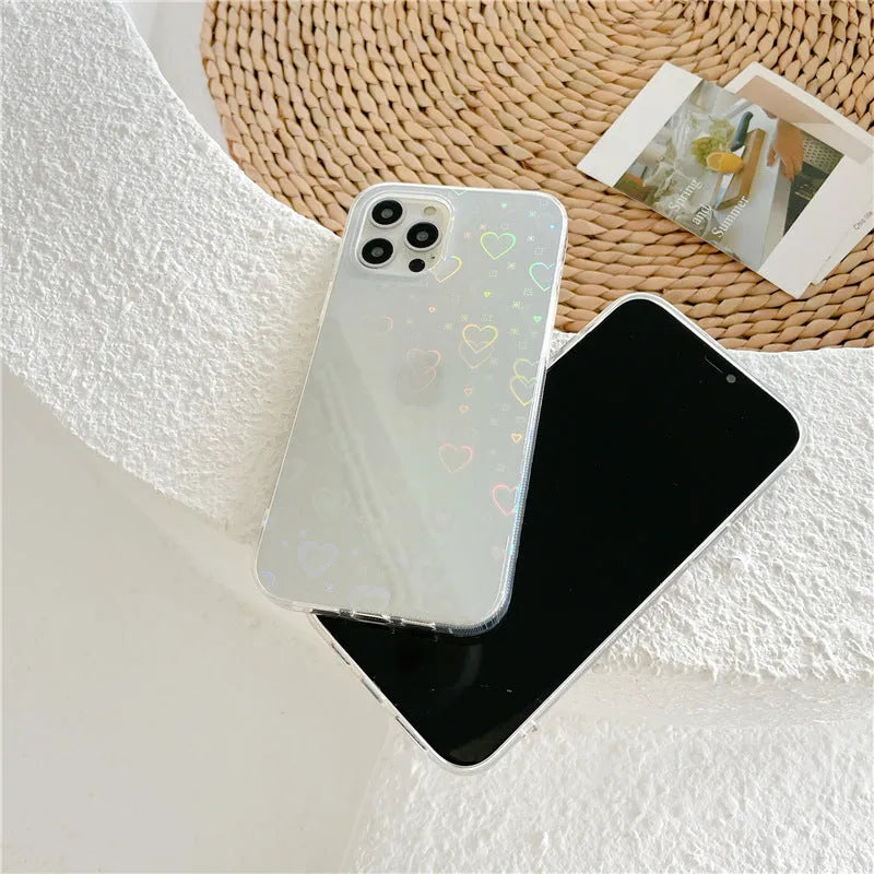 Transparent silicone iPhone case with a laser-etched colourful love design, shown next to a butterfly-accented variant.
