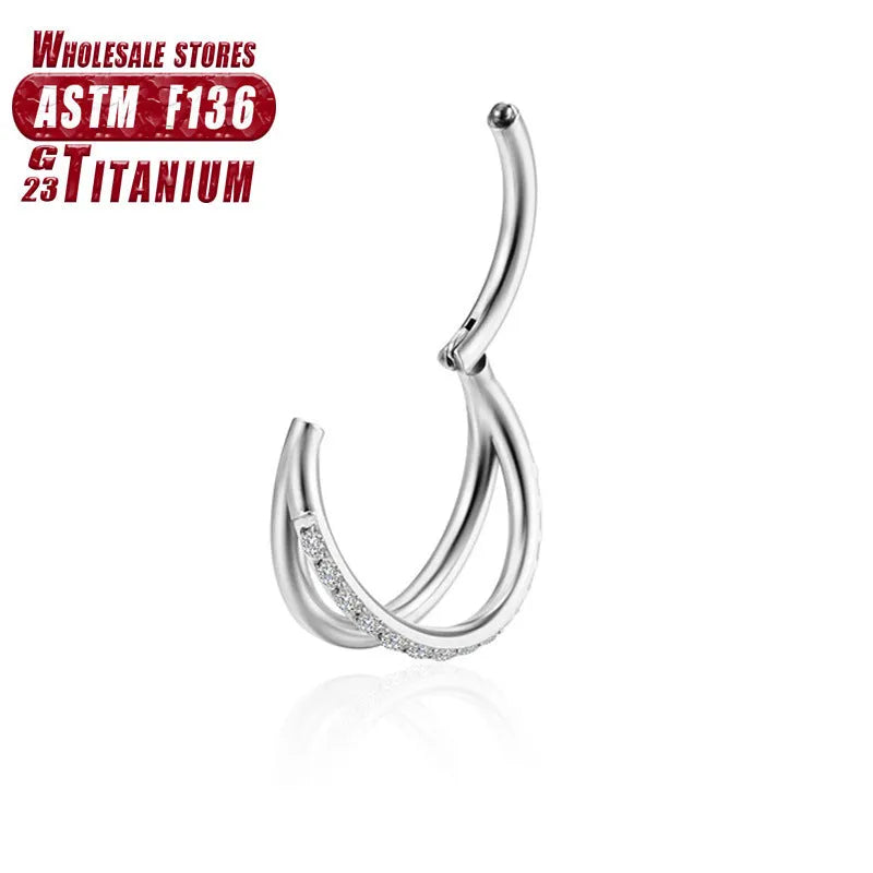 Titanium alloy straight barbell nose ring in silver with diamond detail on a grey background.
