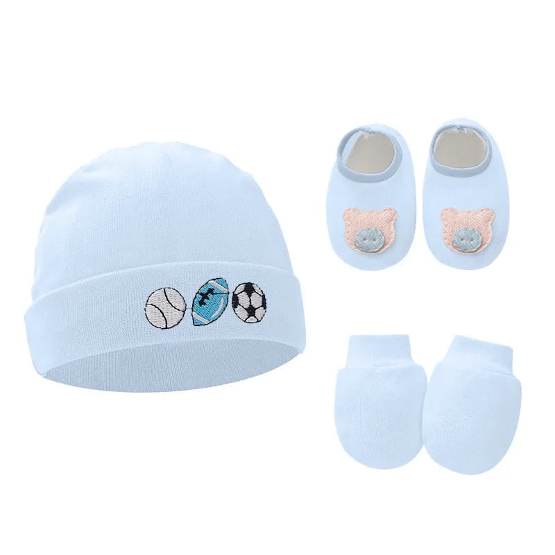 Set of white, light blue, and grey cotton baby pullover caps, gloves, and foot covers for infants.