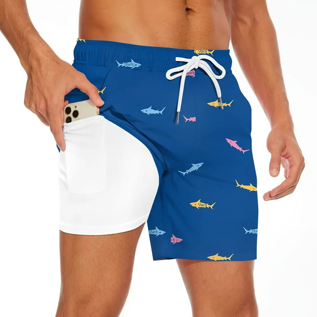 Men's shark figure straight-leg drawstring shorts in blue, shown on a model.